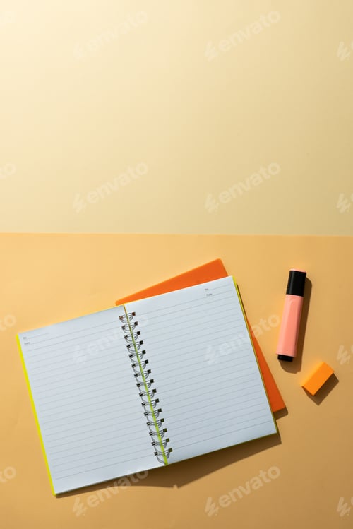 Preview: Flat lay of notebooks and highlighter with copy space on yellow background