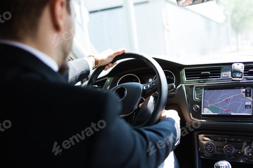 Preview: Man using navigator in car
