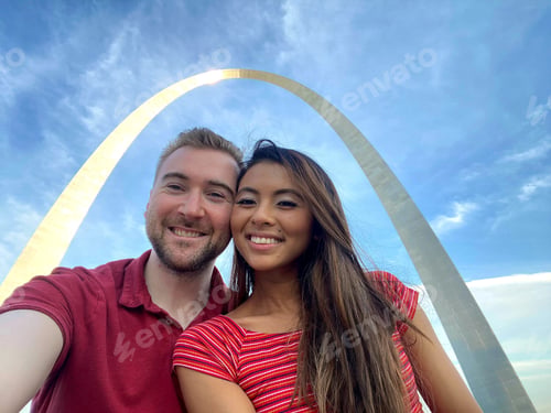 Smiling Couple Visit Gateway Arch in Saint Louis