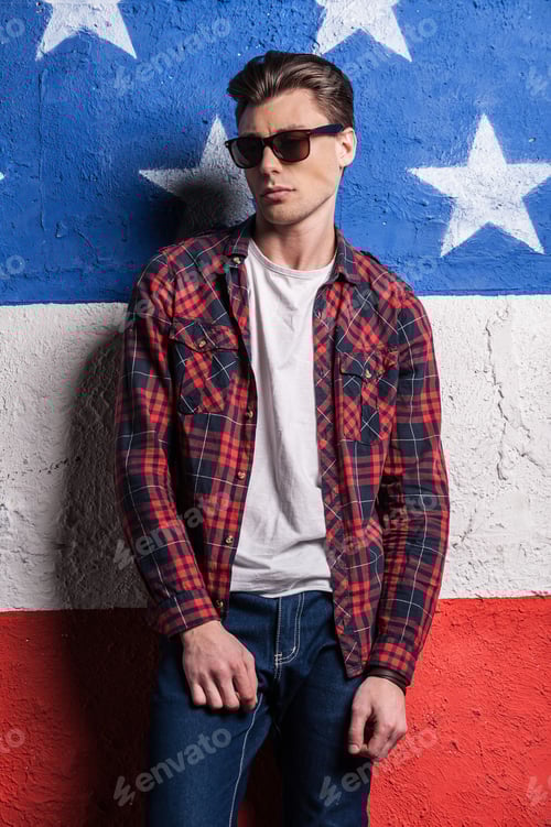 Preview: Young Man in Fashionable Outfit Posing by Wall