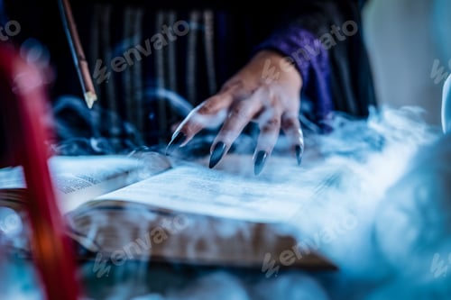 Preview: Witch's Hand On Magic Book