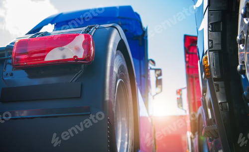Preview: Semi Tractor Trucks Staying Next to Each Other on a Parking