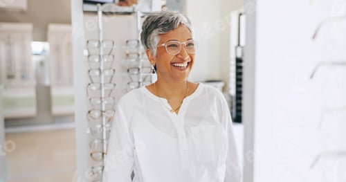 Preview: Glasses, happy and mirror with mature woman in store for eye care, healthcare and optometry. Shoppi