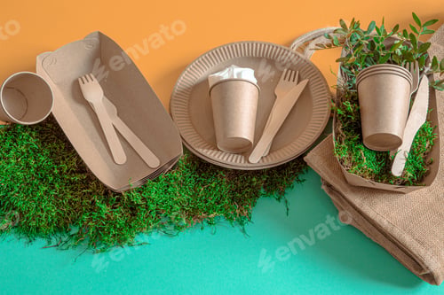 Preview: Eco-friendly, disposable, recyclable tableware on a colored background .