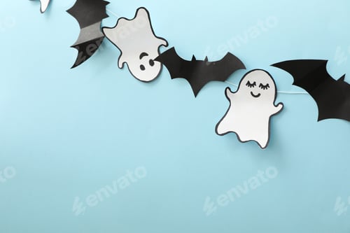Preview: Paper ghosts and bats on blue background, space for text