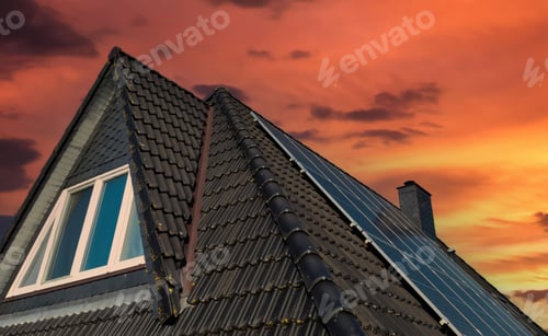 Preview: Solar panels producing clean energy on a roof of a residential house during sunny weather