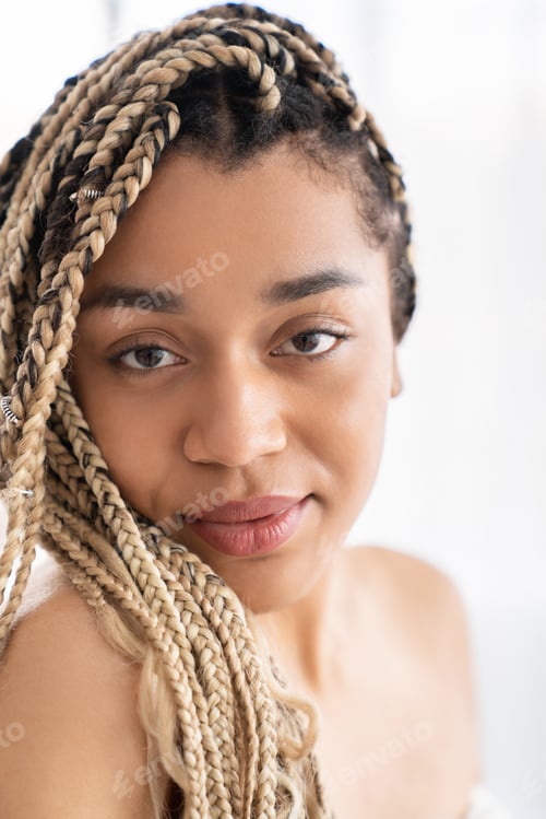 Preview: Charming african-american young woman with afro braids shirtless naked with clean