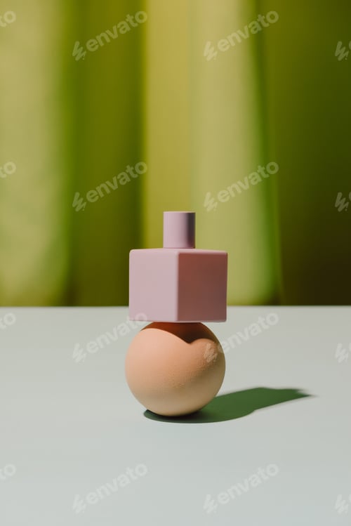 Preview: ball and perfume on green background