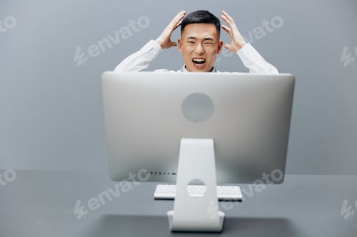 Preview: manager sits at a desk in front of a computer Internet Gray background