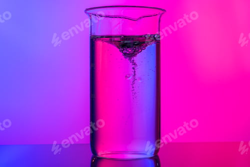 Preview: Chemical glassware close up on neon pink-purple background
