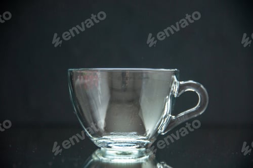 Preview: Front view of glass cup on dark wave background with free space