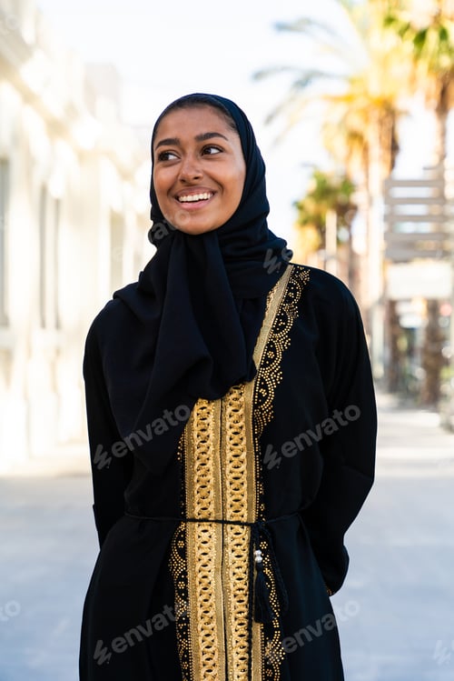 Preview: Traditional arab woman wearing abaya outdoors