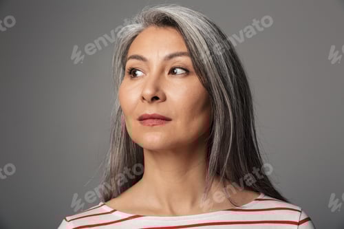 Preview: Image of adult woman with long white hair looking aside at empty space