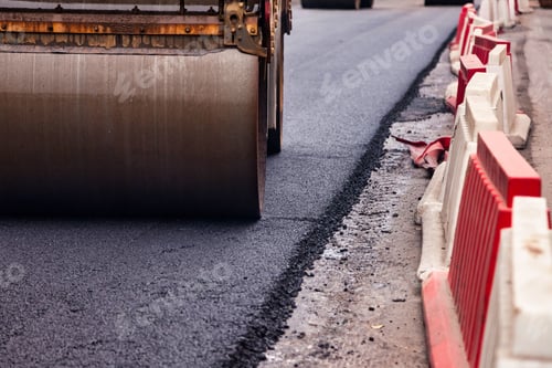 Preview: Asphalt Paving Process Underway on City Roadway During Daytime Hours