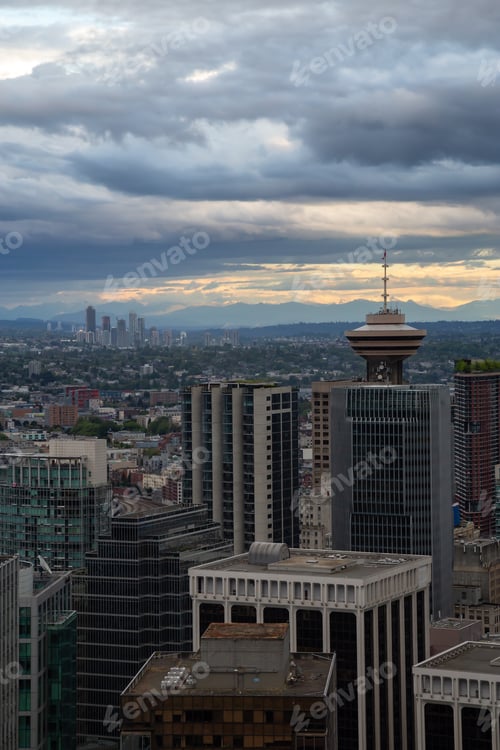 Preview: Aerial view of Downtown City during a stormy summer sunset