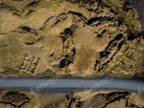 Preview: top view of empty road between brown fields, snaefellsnes, iceland