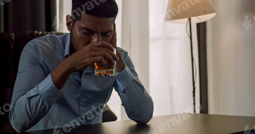 Preview: A businessman drinking alcohol to relieve depressed and stressed with problems in his life.