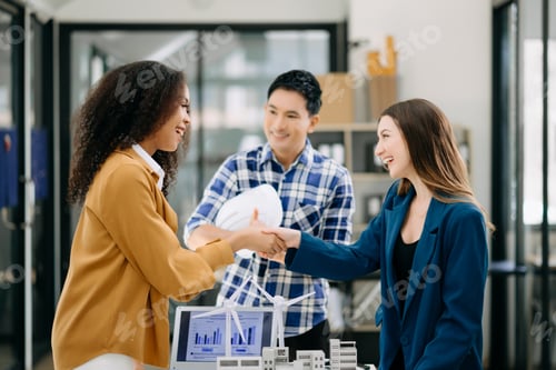 Preview: business people shaking hands during a meeting in office