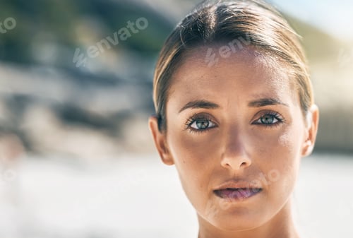 Preview: Portrait of woman with serious face at the beach, thinking and determined. Inspiration, motivation