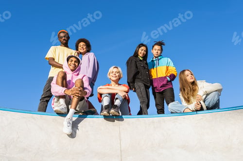 Preview: Multiracial group of young friends bonding outdoors