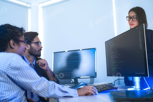 Preview: Diverse software developers in a lively discussion about a project.