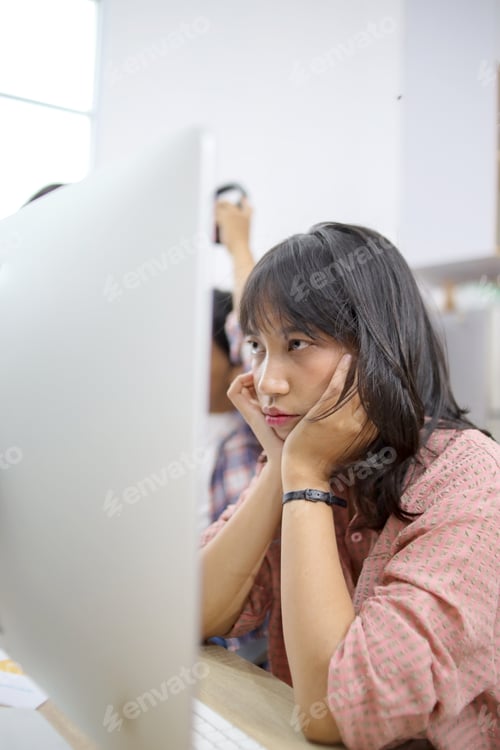Preview: Woman Looking at Computer