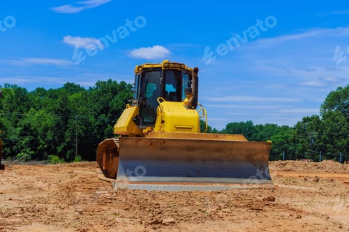 Preview: Earthworks on construction site with a powerful wheel loader bulldozer