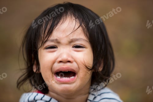 Preview: Close up Little kid girl crying with tearful on her face.