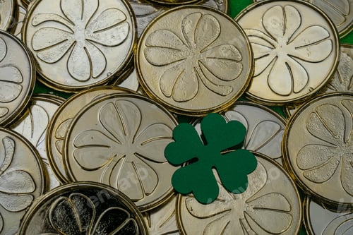 Preview: Golden coins with clovers background