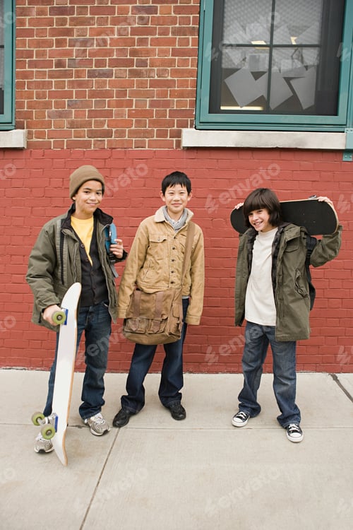 Preview: Three friends with their skateboards enjoying a cool day in the city