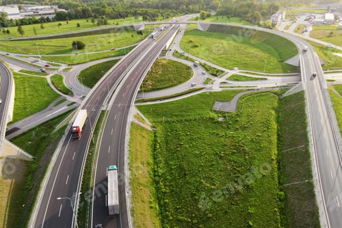 Preview: Cars moving on transport road junction in city, aerial view