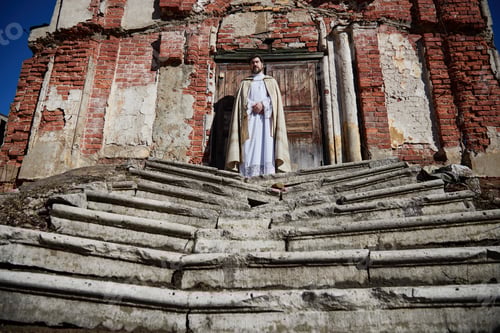 Preview: Middle Aged Priest Standing Outside Old Church