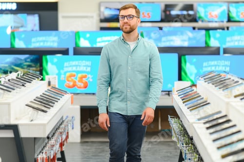 Preview: Portrait of a handsome bearded man in a home appliance store