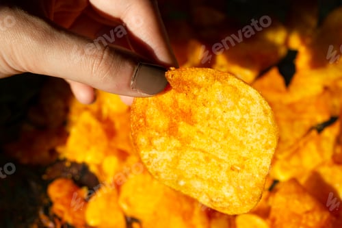 Preview: Woman eating chips snacks close up