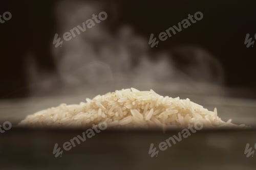 Preview: Hot white Thai jasmine long grain rice with steam in a bowl. Organic vegetarian healthy food.
