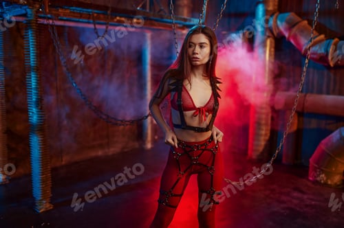 Preview: Sexy woman in red bdsm suit chained up
