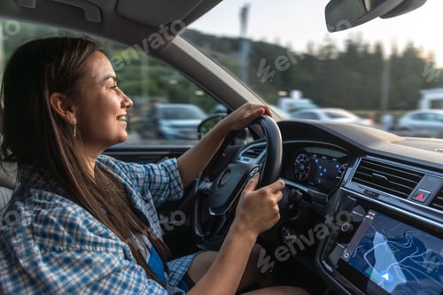 Preview: Woman driving in the evening traffic. Stylish city journey