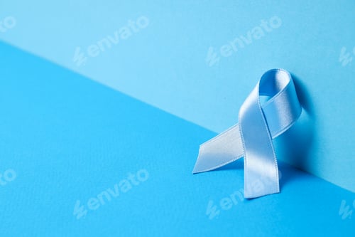 Preview: Blue satin ribbon on blue background, Movember concept