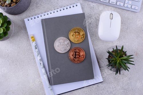Preview: Bitcoin coins on office desk. Cryptocurrency concept