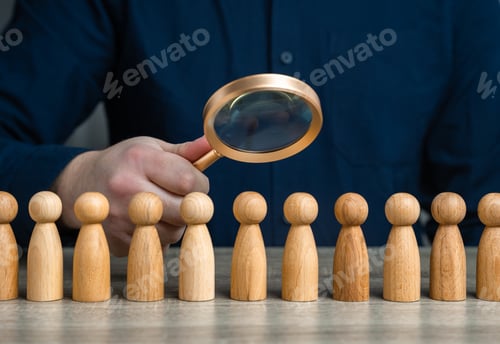 Preview: A man studies people through a magnifying glass.