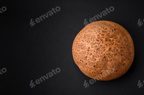 Preview: Fresh crispy brown bread with sesame seeds and spices