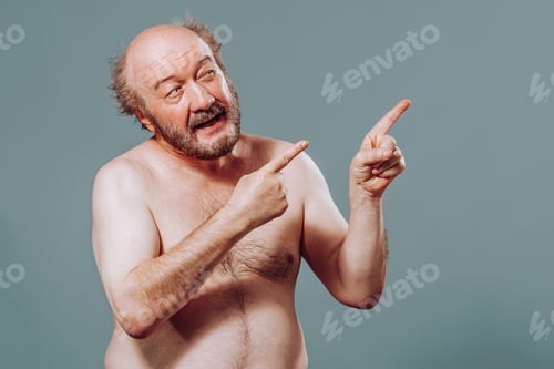 Preview: Front view elderly man stand from left looking to right pointing there index fingers of both hands.