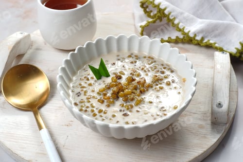 Preview: Indonesian traditional dessert.Bubur kacang ijo or Mungbean Porridge,serven in a bowl with coconut m
