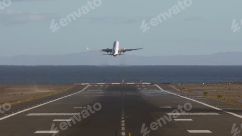 Preview: Airplane taking off and flying over the sea