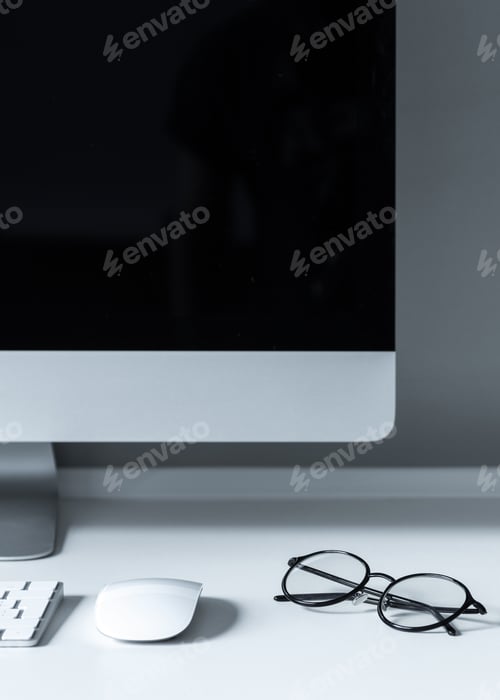 Preview: glasses and computer mouse on working table