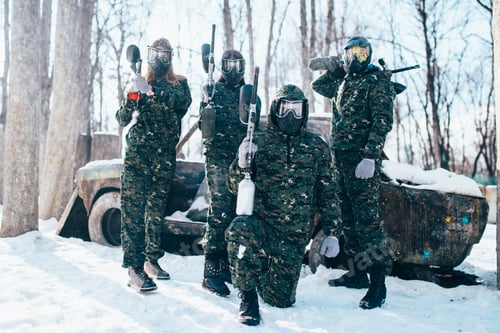 Preview: Paintball team poses with marker guns