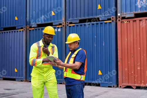 Preview: 2 engineer working in container storage yard use digital tablet check quantity prepare to delivery