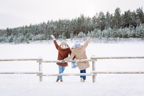 Preview: Happy friends having fun playing in winter park. Friends communicate and enjoying nature.