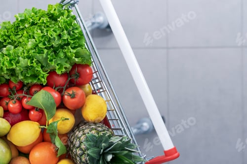 Preview: Supermarket shopping cart full of fresh greens