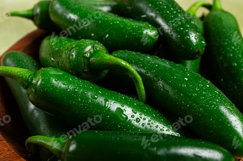 Preview: fresh padron pepper, raw, in a wooden bowl, on the table,
